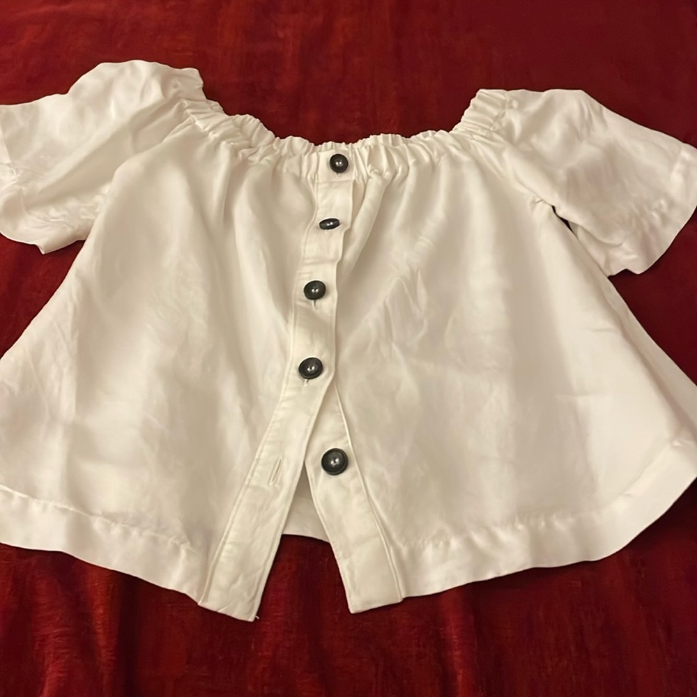 White cotton blouse. On or off-shoulder.